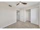 Carpeted bedroom featuring a ceiling fan and ample closet space at 2604 W Wolf St, Phoenix, AZ 85017