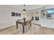 Cozy dining room with modern light fixture and adjacent access to the backyard at 2604 W Wolf St, Phoenix, AZ 85017