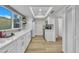 Modern kitchen featuring white cabinets, quartz countertops, and a large window at 2604 W Wolf St, Phoenix, AZ 85017