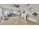 Bright living room boasts modern decor, wood floors, and a stylish ceiling fan at 2604 W Wolf St, Phoenix, AZ 85017
