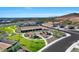 An aerial view showing park amenities including sports field, playground and community gathering area surrounded by desert landscape at 28251 N 134Th Dr, Peoria, AZ 85383