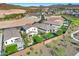 Aerial view of new homes with backyard patios, desert landscaping, and neighborhood streets at 28251 N 134Th Dr, Peoria, AZ 85383