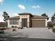 Charming single-story home featuring a low-pitched roofline, neutral colors, and a two-car garage at 28285 N 134Th Dr, Peoria, AZ 85383