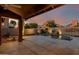 Covered patio view of pool, backyard with desert landscaping and privacy wall at 29241 N 46Th St, Cave Creek, AZ 85331