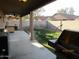 Spacious backyard featuring a covered patio and walled border at 3004 W Running Deer Trl, Phoenix, AZ 85083