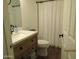 Bathroom featuring modern vanity, toilet, and shower with a striped curtain at 3004 W Running Deer Trl, Phoenix, AZ 85083