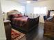 Well-lit bedroom featuring a decorative sleigh bed and ample natural light from the window at 3004 W Running Deer Trl, Phoenix, AZ 85083