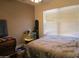 Bedroom with a window view, aquarium and minimal decor at 3004 W Running Deer Trl, Phoenix, AZ 85083