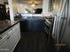 Open-concept kitchen with stainless steel appliances, granite counters, and a sink island at 3004 W Running Deer Trl, Phoenix, AZ 85083