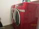 Bright red front loading washer and dryer at 3004 W Running Deer Trl, Phoenix, AZ 85083