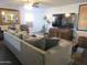 Comfortable living room with a large sofa, entertainment center, and a view of the home's interior at 3004 W Running Deer Trl, Phoenix, AZ 85083