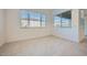 Bright bedroom featuring tile flooring, recessed lighting, and a view to the outside at 3252 W Peak View Rd, Phoenix, AZ 85083