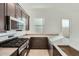 Contemporary kitchen with stainless steel appliances, stone countertops, and gas range at 3252 W Peak View Rd, Phoenix, AZ 85083