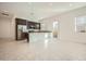 Open-concept kitchen with stainless steel appliances, dark cabinetry and a breakfast bar at 3252 W Peak View Rd, Phoenix, AZ 85083
