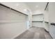 Bright walk-in closet with rod and shelf storage, and plush gray carpeting at 3252 W Peak View Rd, Phoenix, AZ 85083