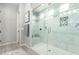 Bright bathroom features a glass shower with modern fixtures and built in shampoo storage at 3527 E Arabian Dr, Gilbert, AZ 85296