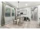 Elegant dining area with modern lighting, round table, and built-in wine storage at 3527 E Arabian Dr, Gilbert, AZ 85296