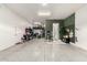This spacious three-car garage is well lit and offers storage shelves and wall-mounted bike racks at 3527 E Arabian Dr, Gilbert, AZ 85296