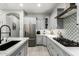 Bright, modern kitchen with stone backsplash and stainless steel appliances at 3527 E Arabian Dr, Gilbert, AZ 85296