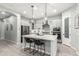 Bright kitchen featuring a large island, modern appliances, and stylish pendant lighting at 3527 E Arabian Dr, Gilbert, AZ 85296
