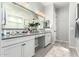Bathroom with dual vanities, large mirrors, and contemporary design at 3527 E Arabian Dr, Gilbert, AZ 85296