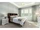 Serene bedroom with tray ceilings, neutral tones, and a large window for natural light at 3527 E Arabian Dr, Gilbert, AZ 85296