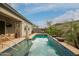 Inviting backyard featuring a pool, a patio area, and desert landscaping at 3527 E Arabian Dr, Gilbert, AZ 85296