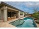 Inviting backyard featuring a pool, a patio area, and desert landscaping at 3527 E Arabian Dr, Gilbert, AZ 85296