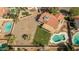Amazing aerial shot of a home with a unique swimming pool, gravel landscape, and healthy lawn area at 3620 N Aspen Dr, Avondale, AZ 85392