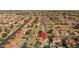 Gorgeous areal view of a neighborhood pinpointing a property with a pool, landscaped backyard and more at 3620 N Aspen Dr, Avondale, AZ 85392
