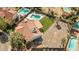 An eye-level shot of a house showcasing a serene pool, a large gravel yard and a well-maintained lawn at 3620 N Aspen Dr, Avondale, AZ 85392