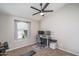 Neutral bedroom featuring a ceiling fan, workstation, and comfortable carpet at 3620 N Aspen Dr, Avondale, AZ 85392