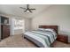 Bright bedroom featuring a vaulted ceiling, ceiling fan and a window for natural light at 3620 N Aspen Dr, Avondale, AZ 85392