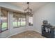 Cozy dining area with large windows offering bright natural light and a modern light fixture at 3620 N Aspen Dr, Avondale, AZ 85392