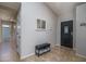 Inviting entryway with tile floors, a storage bench, and access to various rooms at 3620 N Aspen Dr, Avondale, AZ 85392
