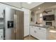 Contemporary kitchen with a stainless steel refrigerator and granite countertop island at 3620 N Aspen Dr, Avondale, AZ 85392