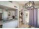 Open-concept kitchen flowing into living space and a sliding door to the backyard pool area at 3620 N Aspen Dr, Avondale, AZ 85392