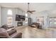 Inviting living room with a fireplace, high ceilings, and views of the pool at 3620 N Aspen Dr, Avondale, AZ 85392