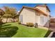 Well-maintained backyard with artificial turf, a storage shed, and exterior hose at 405 E Wescott Dr, Phoenix, AZ 85024