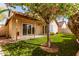 Charming backyard featuring a covered patio and well-maintained artificial turf at 405 E Wescott Dr, Phoenix, AZ 85024
