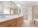 Primary bath features a double sink vanity, walk in shower, and separate tub at 405 E Wescott Dr, Phoenix, AZ 85024