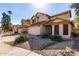 Street view showcasing multiple two-story homes, each with a two-car garage and drought-resistant landscaping at 405 E Wescott Dr, Phoenix, AZ 85024