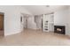 Spacious living area featuring tile flooring, a fireplace, and an open staircase with built-in shelves at 405 E Wescott Dr, Phoenix, AZ 85024