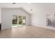 Bright, open living room with tile flooring, a sliding glass door, and lots of natural light at 405 E Wescott Dr, Phoenix, AZ 85024