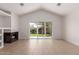 Cozy living room with tile flooring, fireplace, and sliding glass door leading to the backyard at 405 E Wescott Dr, Phoenix, AZ 85024