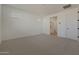 Spacious bedroom with carpet, white walls, and ensuite bathroom at 4050 W Nora Dr, San Tan Valley, AZ 85144