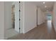 Hallway featuring tile flooring and doorways at 4050 W Nora Dr, San Tan Valley, AZ 85144