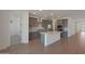 Modern kitchen with gray cabinets, stainless steel appliances, and a central island at 4050 W Nora Dr, San Tan Valley, AZ 85144