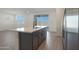 Kitchen island with barstool seating overlooks the living room, perfect for entertaining at 4050 W Nora Dr, San Tan Valley, AZ 85144