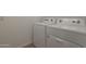 Laundry room featuring a white washer and dryer set, offering convenience at 4050 W Nora Dr, San Tan Valley, AZ 85144